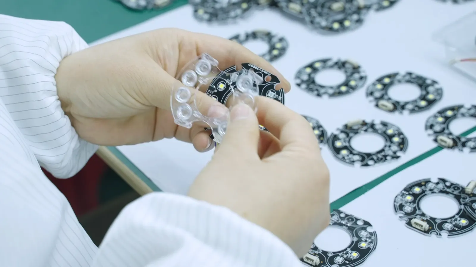 Attaching LED boards to lens covers